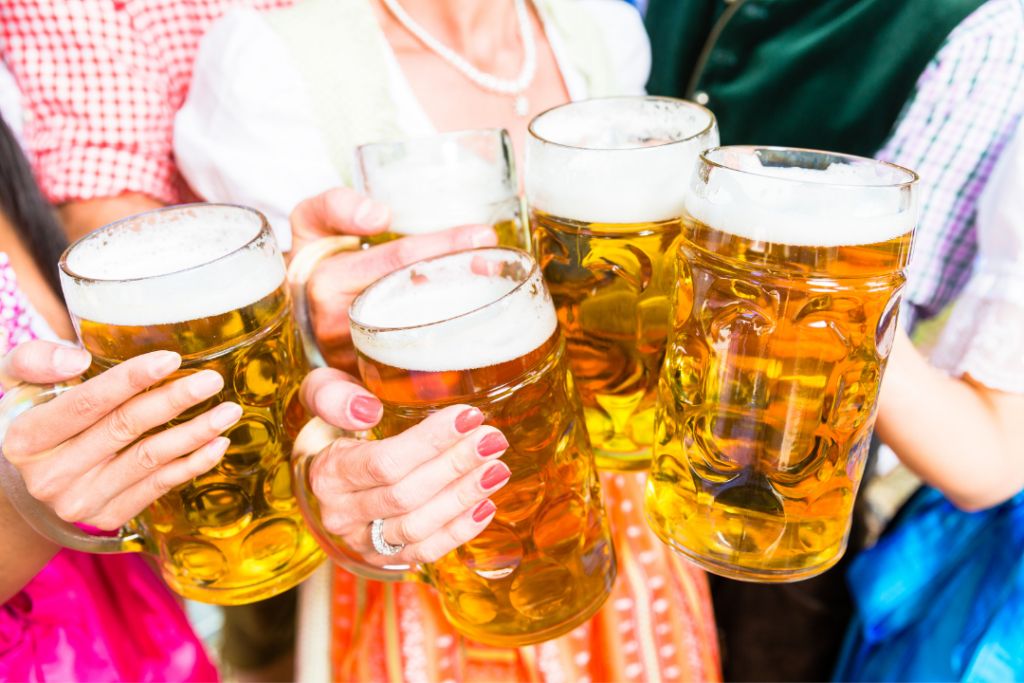 Clinking Glass with Beer in Bavarian Beer Garden