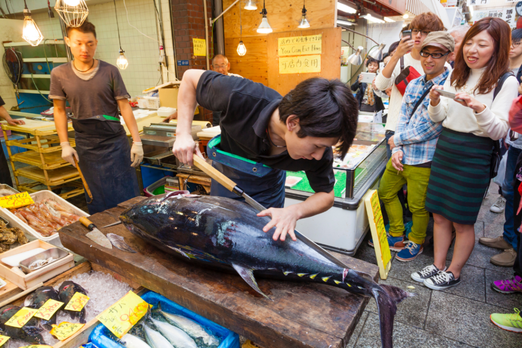 Cutting a giant tuna in Kuromon Market, Osaka, Japan