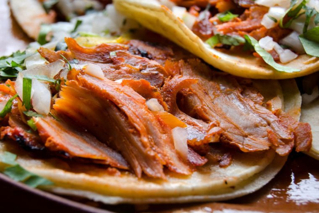 Traditional tacos al pastor are a must - Getty Images