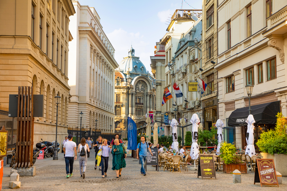 Bucharest, Rumania - 28.04.2018: Tourists in Old Town and Restaurants on Downtown Lipscani Street, one of the busiest streets of central Bucharest, Rumania