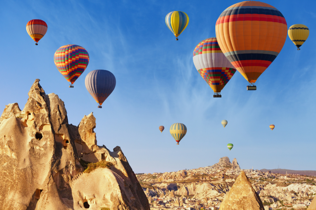 Hot air ballooning near Uchisar Castle in Cappadocia