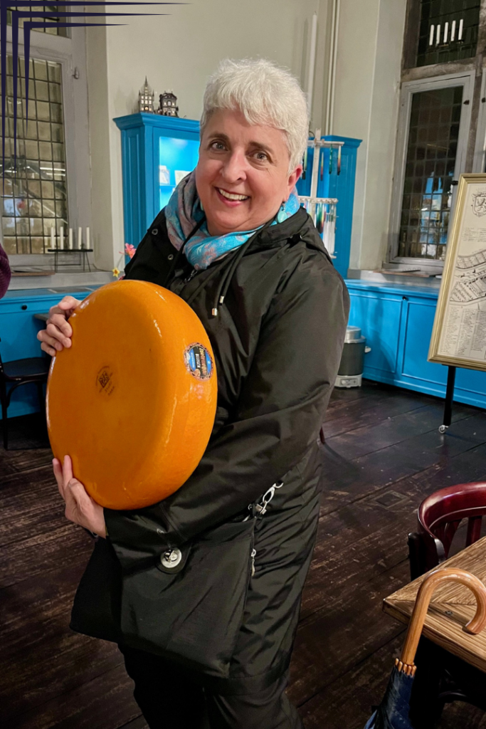 Cindy with a wheel of Gouda - Cindy Dykman